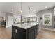 Kitchen island with marble countertop and stainless steel sink at 4105 Woodwind Dr, Cumming, GA 30028