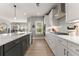 Modern kitchen features sleek white cabinets and marble countertops at 4105 Woodwind Dr, Cumming, GA 30028