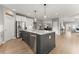 Open concept kitchen with large center island and stainless steel appliances at 4105 Woodwind Dr, Cumming, GA 30028
