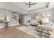 Open living room showcases hardwood floors, neutral colors, staircase, and modern furnishings at 4105 Woodwind Dr, Cumming, GA 30028