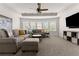 Spacious living room with neutral furniture, and a ceiling fan at 4105 Woodwind Dr, Cumming, GA 30028