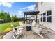 Comfortable outdoor patio featuring a fire pit and pergola covered seating area at 4105 Woodwind Dr, Cumming, GA 30028