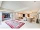 Open basement area features a carpet, ample lighting, dining, sitting areas, and a decorative wall accent at 115 Cross Roads Ct, Atlanta, GA 30327