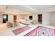 Large basement featuring multiple lounge areas, a dining table, storage, and unique decor at 115 Cross Roads Ct, Atlanta, GA 30327