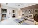 Spacious bedroom with natural light, tatami mats, and an array of elegant Asian-themed artwork at 115 Cross Roads Ct, Atlanta, GA 30327