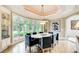 Dining room with bay window and modern chandelier at 115 Cross Roads Ct, Atlanta, GA 30327