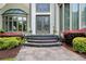 Elegant front entrance with stained glass double doors and stone walkway at 115 Cross Roads Ct, Atlanta, GA 30327