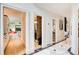 Hallway features marble floors and provides access to the living room and bathrooms at 115 Cross Roads Ct, Atlanta, GA 30327