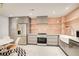 Charming kitchen featuring sleek appliances, grey cabinets, and modern farmhouse sink at 115 Cross Roads Ct, Atlanta, GA 30327