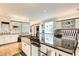 Contemporary kitchen offers stainless steel appliances, ample counter space and a large island at 115 Cross Roads Ct, Atlanta, GA 30327