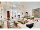 Grand living room with high ceilings, marble floors, and a view of the second floor balcony at 115 Cross Roads Ct, Atlanta, GA 30327