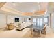 Expansive living room with comfortable seating, dining table, and lots of natural light at 115 Cross Roads Ct, Atlanta, GA 30327