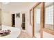 Detailed view of the main bathroom featuring marble floors, a glass shower, and custom sink at 115 Cross Roads Ct, Atlanta, GA 30327