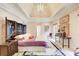 Spacious main bedroom with vaulted ceilings, unique decor, and plush carpet at 115 Cross Roads Ct, Atlanta, GA 30327