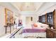 Large main bedroom showcasing custom furnishings, vaulted ceilings, and ample natural light at 115 Cross Roads Ct, Atlanta, GA 30327