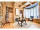 Cozy wood-paneled home office featuring custom built-ins and ample natural light at 115 Cross Roads Ct, Atlanta, GA 30327