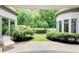 Beautiful backyard patio is surrounded by lush landscaping at 115 Cross Roads Ct, Atlanta, GA 30327