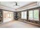 Versatile room with multiple windows, a ceiling fan, and access to other parts of the house at 115 Cross Roads Ct, Atlanta, GA 30327
