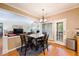 Cozy breakfast area with a dining table and chairs adjacent to the kitchen and living area at 199 Eastham Ct, Suwanee, GA 30024