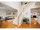 Bright foyer with wood floors and staircase leading to the second level of the home at 199 Eastham Ct, Suwanee, GA 30024