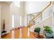 Bright foyer with wood floors and staircase leading to the second level of the home at 199 Eastham Ct, Suwanee, GA 30024