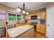 Kitchen featuring wood cabinets, granite countertops, stainless steel appliances, and a center island at 199 Eastham Ct, Suwanee, GA 30024