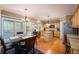 Eat-in kitchen with hardwood floors and granite countertops at 199 Eastham Ct, Suwanee, GA 30024