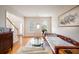 Sunlit living room featuring hardwood floors, neutral walls, and windows with natural light at 199 Eastham Ct, Suwanee, GA 30024