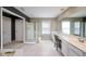 Bathroom with double sinks, large mirrors, walk-in shower with gold trim, and tile flooring at 199 Eastham Ct, Suwanee, GA 30024