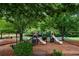 Community playground with multiple slides and climbing structures, set among mature shade trees at 199 Eastham Ct, Suwanee, GA 30024
