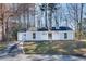 Charming single-story home with light blue siding, white trim, and a well-maintained front yard at 2216 Marbut Farms Trce, Lithonia, GA 30058