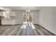 Open-concept kitchen and living room area with gray flooring and a sliding glass door at 2216 Marbut Farms Trce, Lithonia, GA 30058