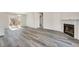 Bright and airy living room featuring modern floors, fireplace, and sliding glass doors to the outdoor space at 2216 Marbut Farms Trce, Lithonia, GA 30058