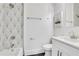Stylish bathroom with a geometric tile accent wall and modern fixtures at 2497 Wawona Dr, Brookhaven, GA 30319