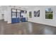 Spacious bonus room with wood floors featuring a built in wet bar, windows and stylish decorations at 2497 Wawona Dr, Brookhaven, GA 30319