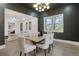 Beautiful dining room with an open floor plan and contemporary lighting fixtures at 2497 Wawona Dr, Brookhaven, GA 30319