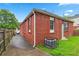 Exterior of brick house showcasing a gated back driveway and grassy yard area at 50 Ormond Sw St, Atlanta, GA 30315