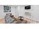 Finished basement with a cozy sitting area, mounted TV, and modern decor at 50 Ormond Sw St, Atlanta, GA 30315