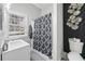Bathroom featuring a sleek vanity, shower with patterned curtain, and modern decor at 50 Ormond Sw St, Atlanta, GA 30315