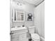 Charming bathroom featuring a vintage vanity, modern mirror, and contemporary artwork at 50 Ormond Sw St, Atlanta, GA 30315