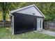 Back exterior view of a black building with a white roof and a concrete patio at 50 Ormond Sw St, Atlanta, GA 30315