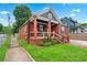 Charming red brick home with black trim, a manicured lawn, and inviting front porch at 50 Ormond Sw St, Atlanta, GA 30315
