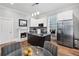 Modern kitchen with stainless steel appliances, an island, and a cozy dining area at 50 Ormond Sw St, Atlanta, GA 30315