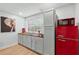 Compact kitchen featuring light grey cabinets, wood countertops, and a retro-style red refrigerator at 50 Ormond Sw St, Atlanta, GA 30315