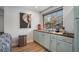 Kitchenette area featuring light blue cabinets, a butcher block counter, and modern appliances at 50 Ormond Sw St, Atlanta, GA 30315