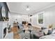 Bright living room with a fireplace, hardwood floors, and stylish contemporary furnishings at 50 Ormond Sw St, Atlanta, GA 30315