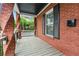 Charming porch with brick columns and black railings, ideal for enjoying the outdoors at 50 Ormond Sw St, Atlanta, GA 30315