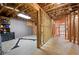 Unfinished basement space with exposed wood framing and concrete floor at 6061 Meridian Nw Dr, Acworth, GA 30101