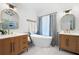 Elegant bathroom featuring double vanities, freestanding tub, and modern fixtures at 6061 Meridian Nw Dr, Acworth, GA 30101