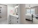 Bright bathroom with white vanity, round mirror, and shower/tub combo at 6061 Meridian Nw Dr, Acworth, GA 30101